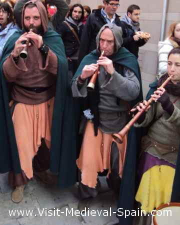 Musicians in medieval costume play traditional catalonian music at Vic Medieval Market