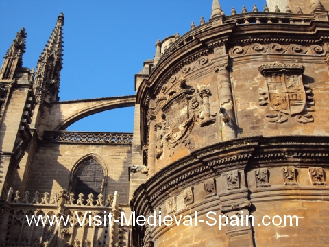 Butresses and carvings on the walls of Seville's medieval cathedral, Seville, Andalusia, Spain